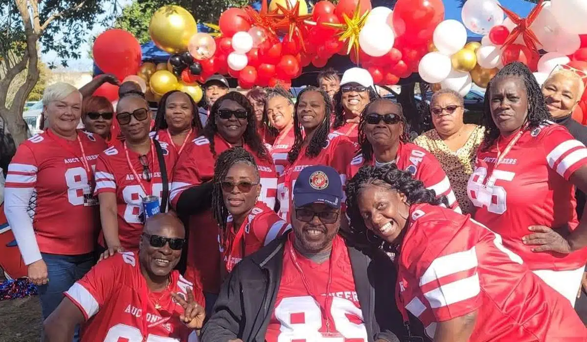 Group of people wearing red jerseys at a celebration