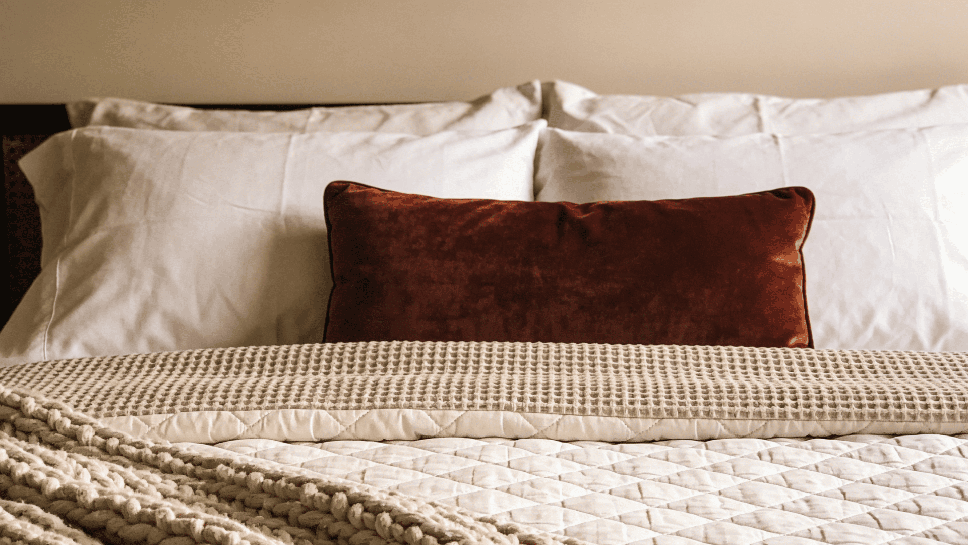 Layered textures create a plush inviting bed