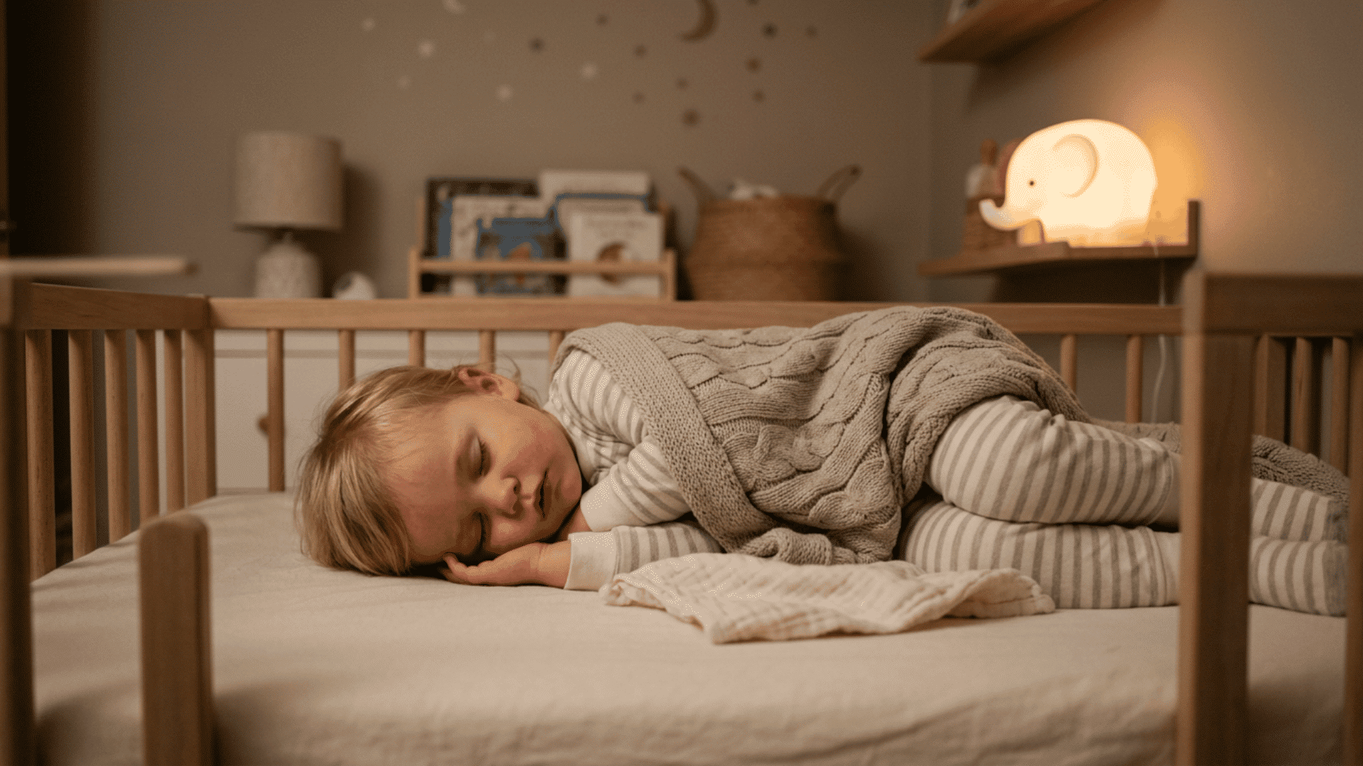 toddler sleeping peacefully in a crib at night