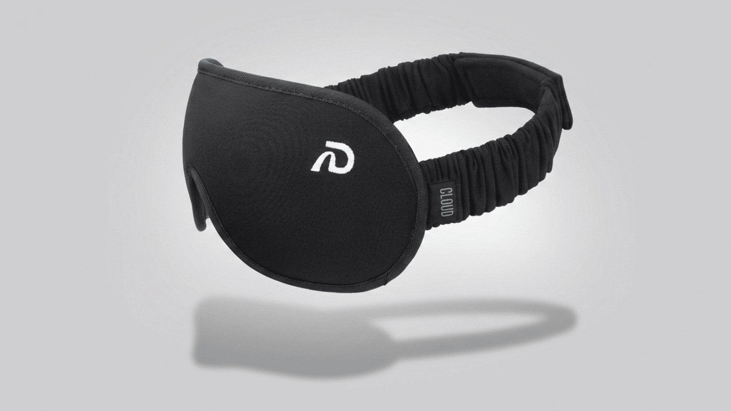 black Dream Recovery sleep mask with broad eye coverage and a wide gathered elastic strap for travel