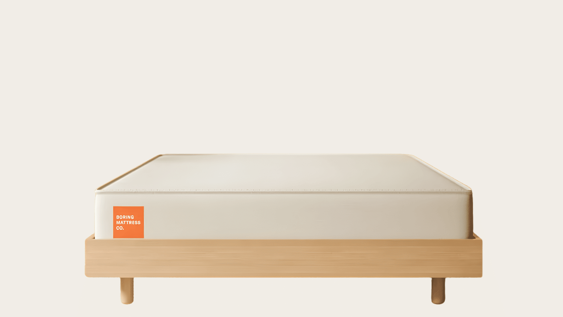 Boring mattress shown with a simple white cover and detailed foam construction.