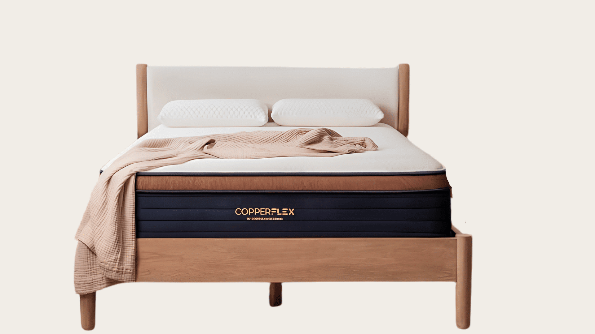 CopperFlex mattress on a wooden bed with white pillows and a beige throw.