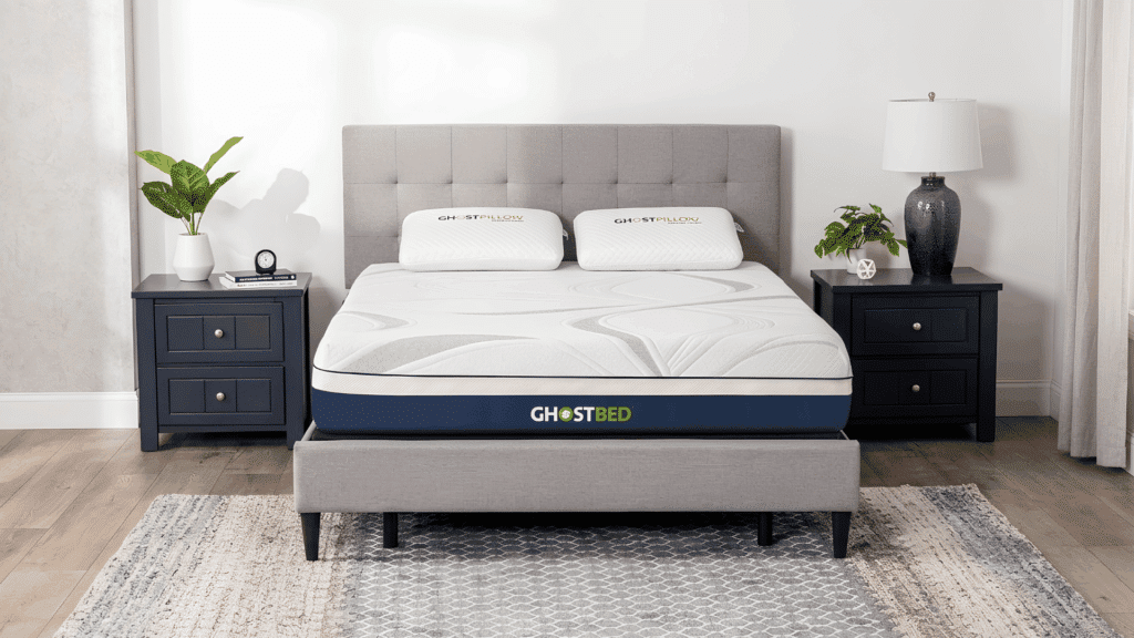 GhostBed memory foam mattress with cooling layers on an upholstered bed frame