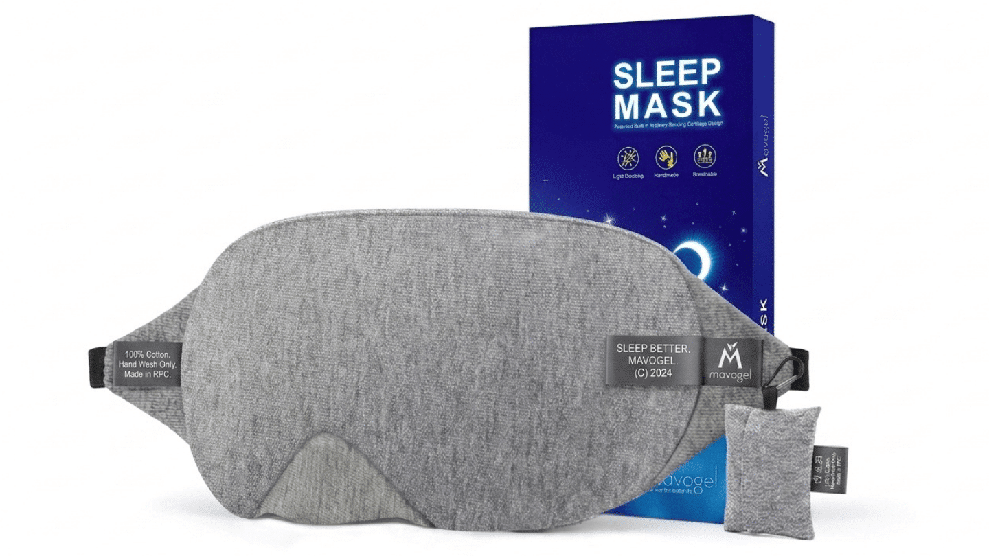 gray Mavogel cotton sleep mask displayed with its blue product box and matching travel pouch set out