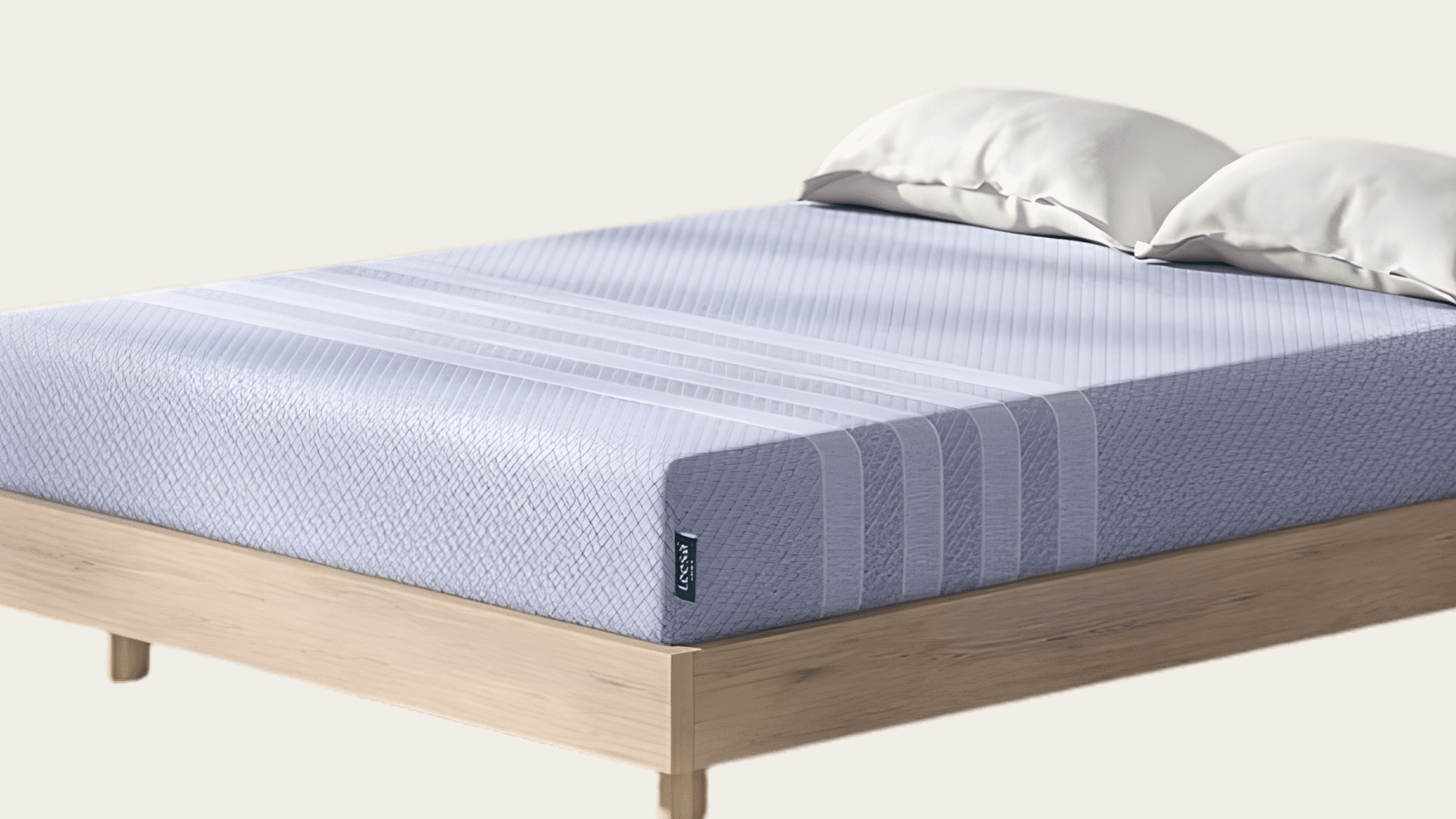 Leesa Studio foam mattress placed on a modern bed frame with pillows and soft bedding.