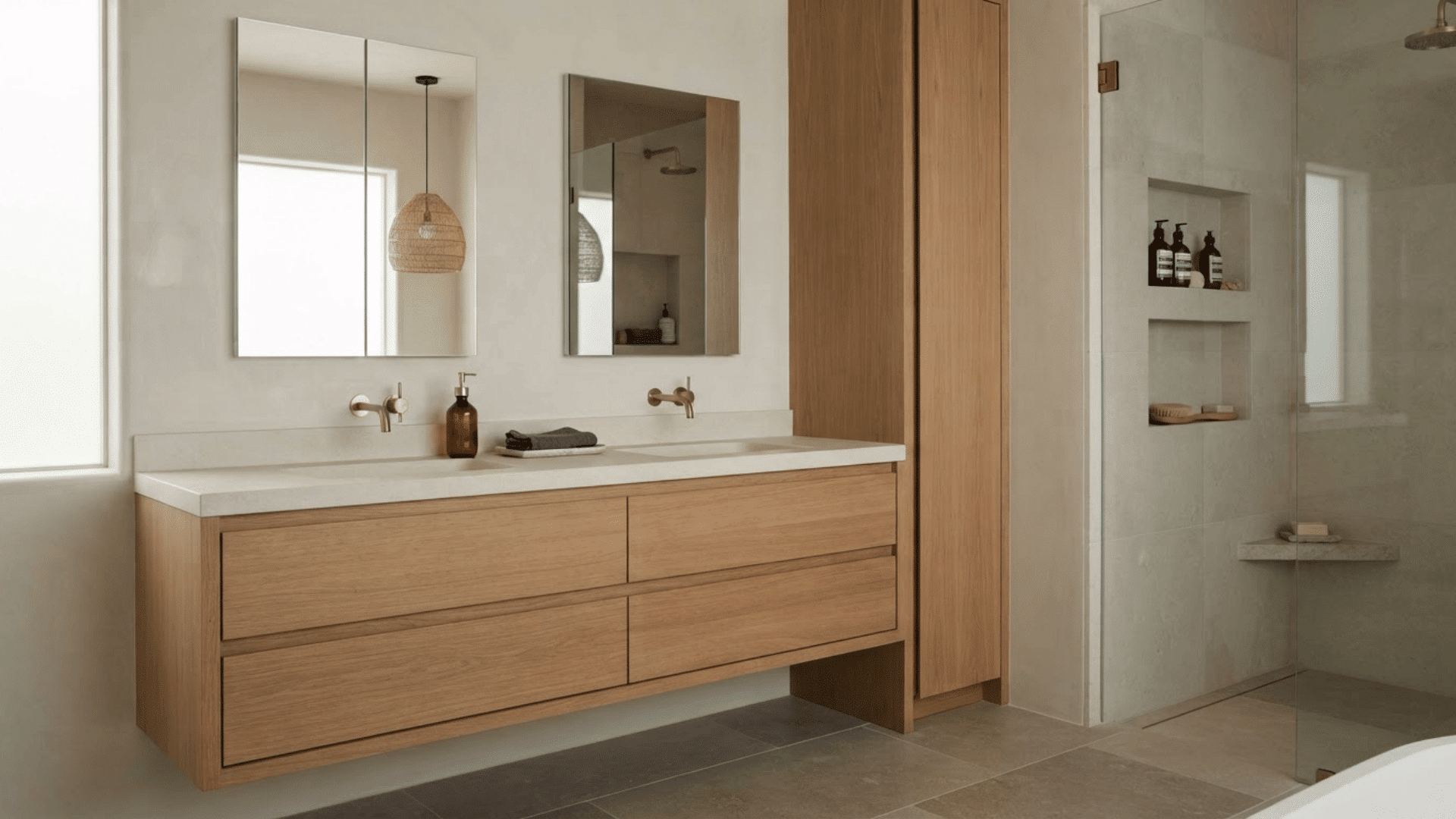 luxury bathroom with dark wood vanity, open towel storage, glass shower, and soft lighting