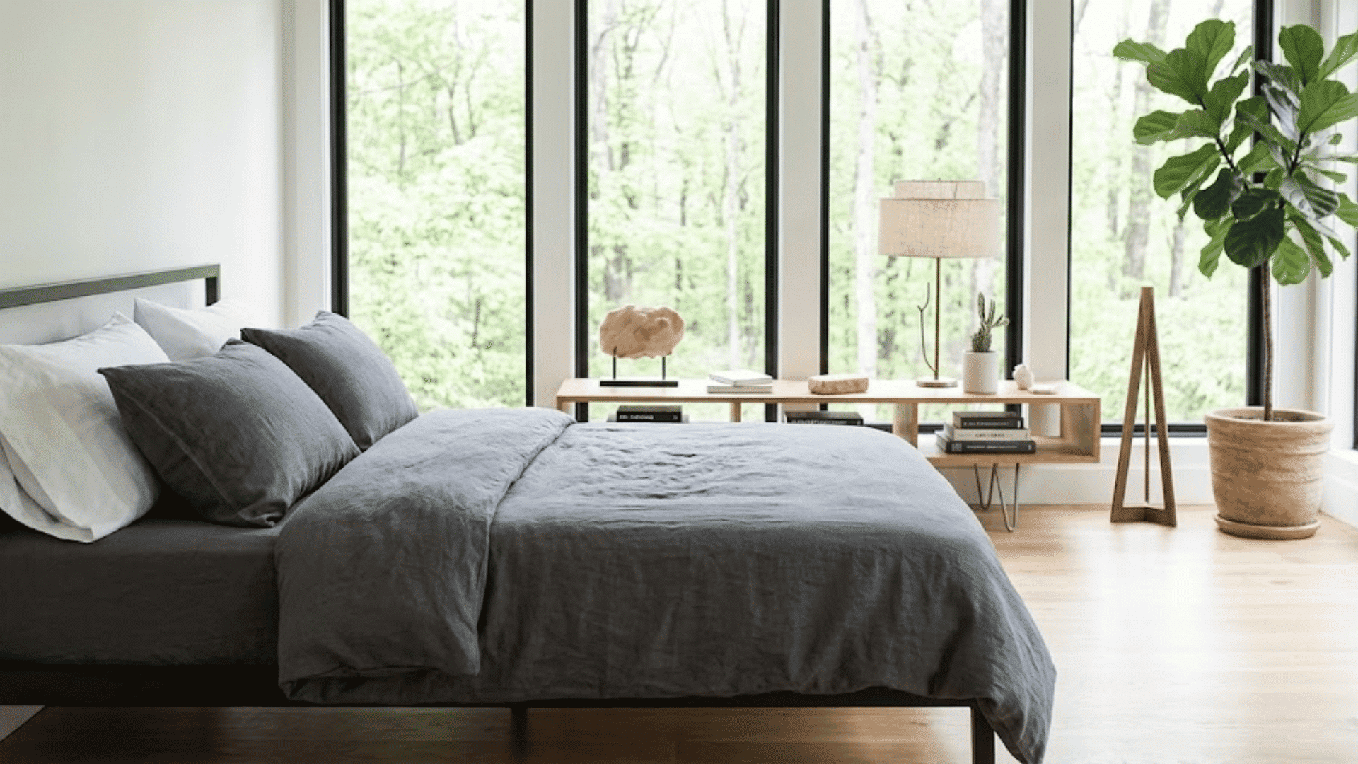 miracle sheets gray bedding set on a modern bed in a bright bedroom with large windows