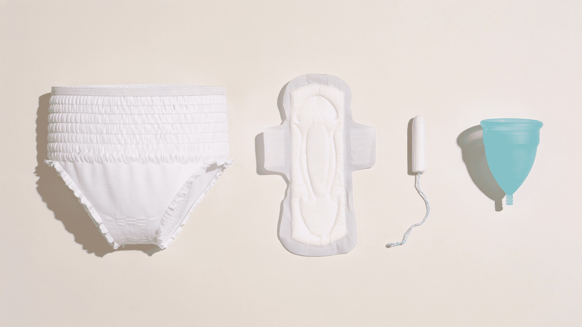 period underwear, pad, tampon, and menstrual cup side by side