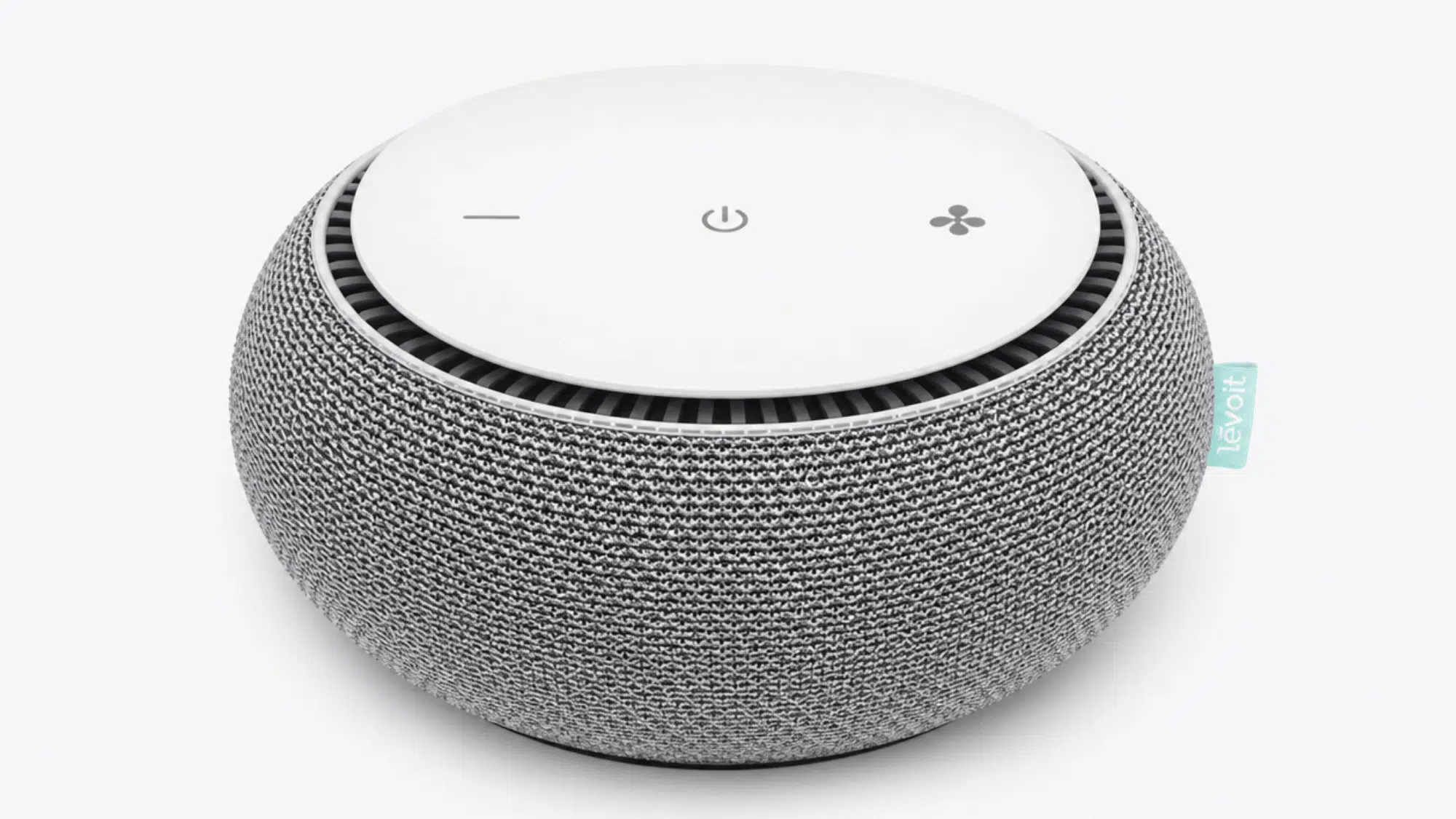 snooz smart white noise machine with fabric-covered round design, top controls, and circular speaker opening on a clean background