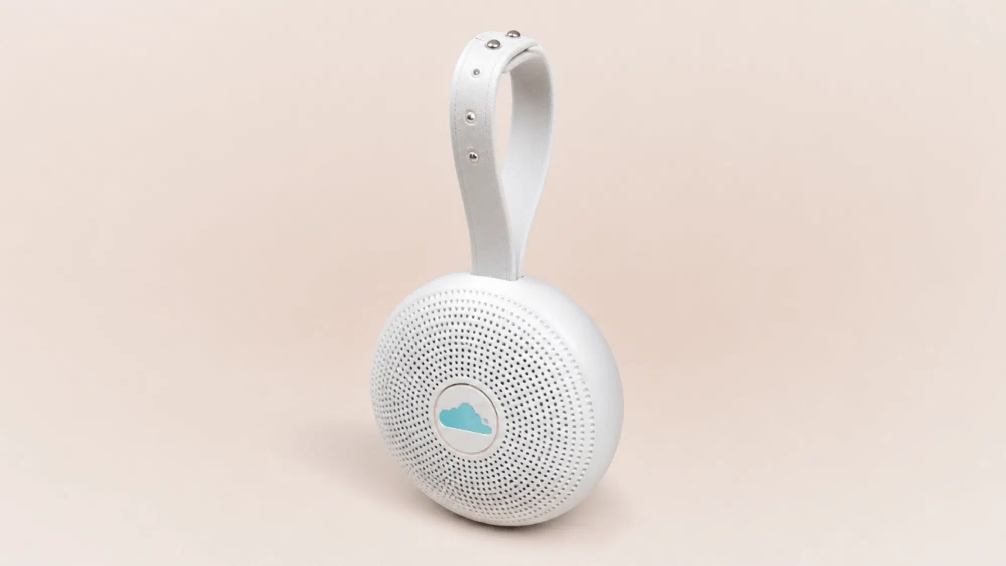 yogasleep nod white noise machine with circular design, speaker grille, timer controls, and sound buttons on a clean background