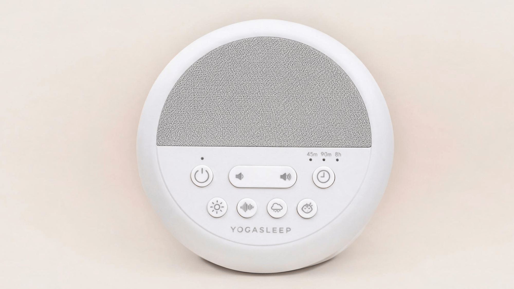 yogasleep nod white noise machine with round design, speaker panel, volume controls, timer buttons, and sound options on a clean background