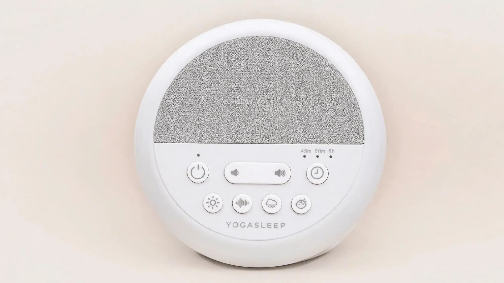 yogasleep nod white noise machine with round design, speaker panel, volume controls, timer buttons, and sound options on a clean background