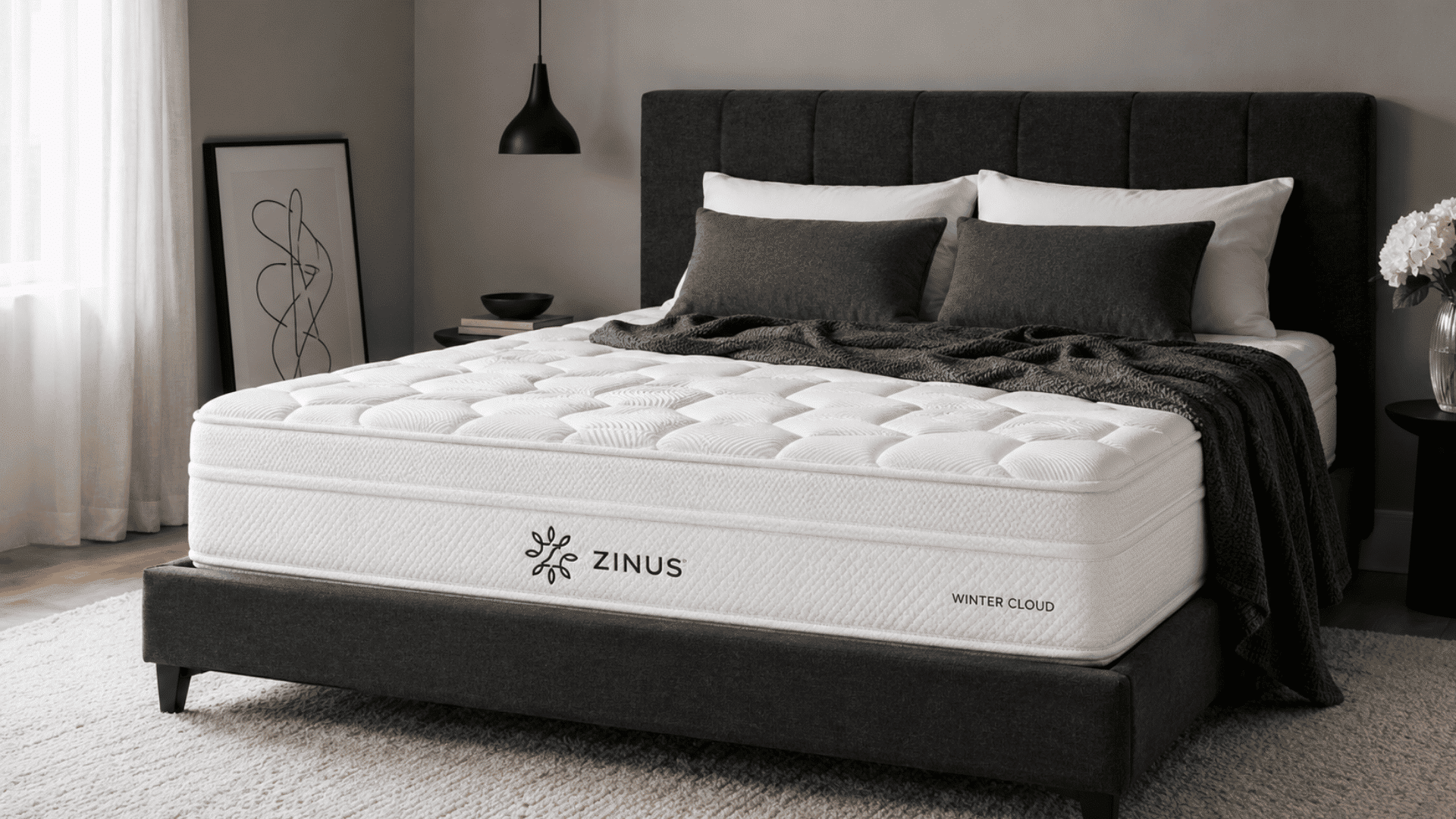 zinus winter cloud mattress on a dark upholstered bed in a modern bedroom