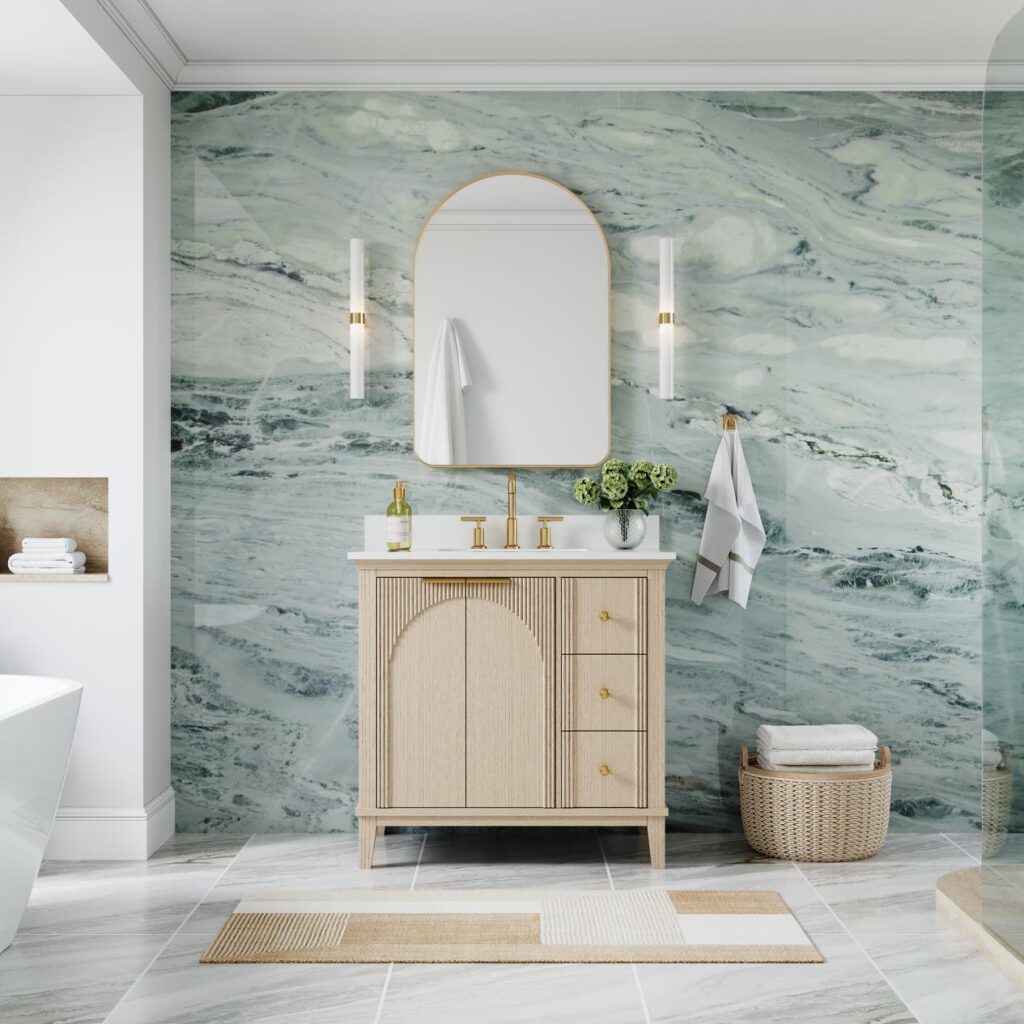 Elegant bathroom with light wood vanity, marble wall, and gold accents in a serene setting