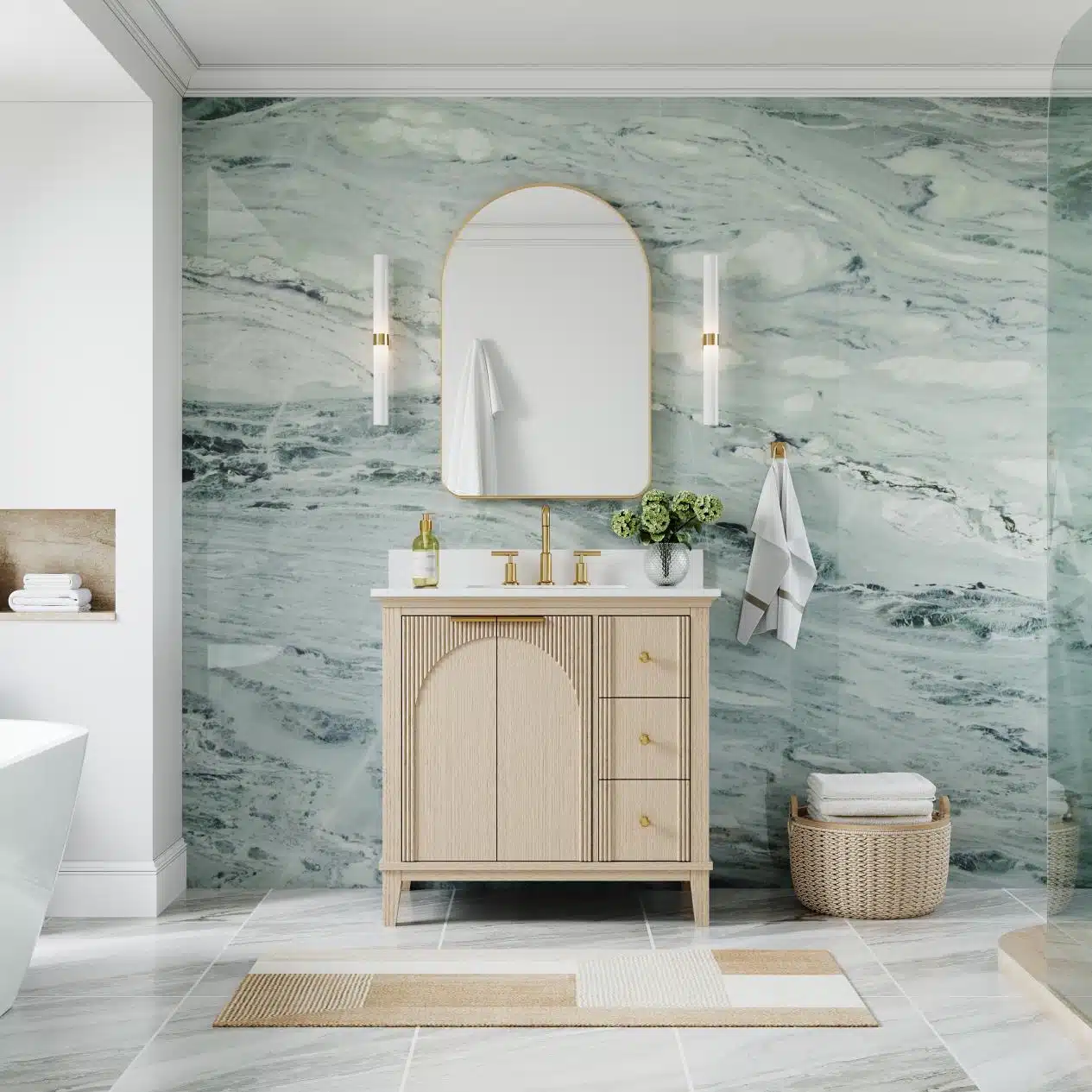 Elegant bathroom with light wood vanity, marble wall, and gold accents in a serene setting