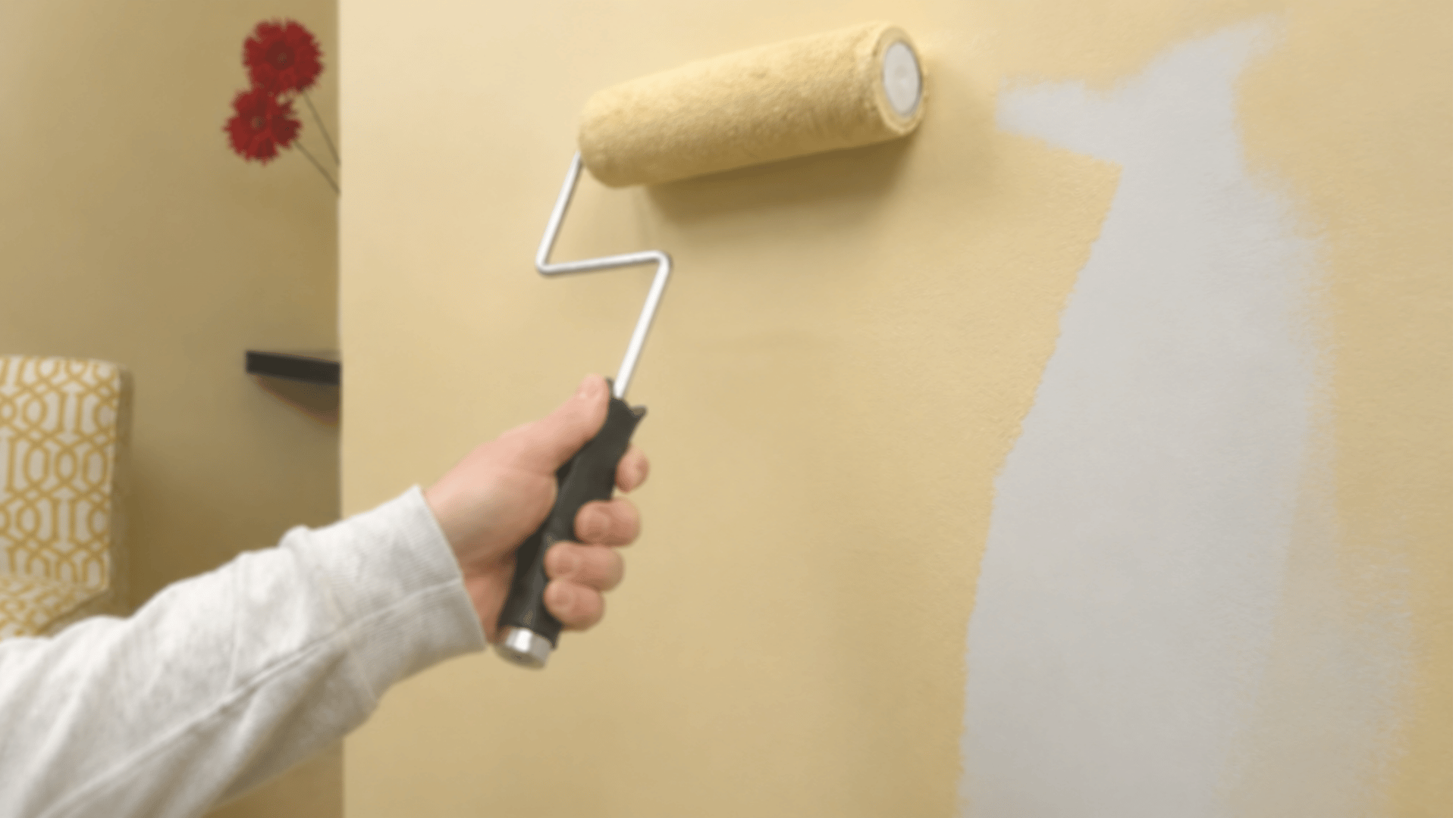 Painting over the repaired drywall to match the surrounding wall.