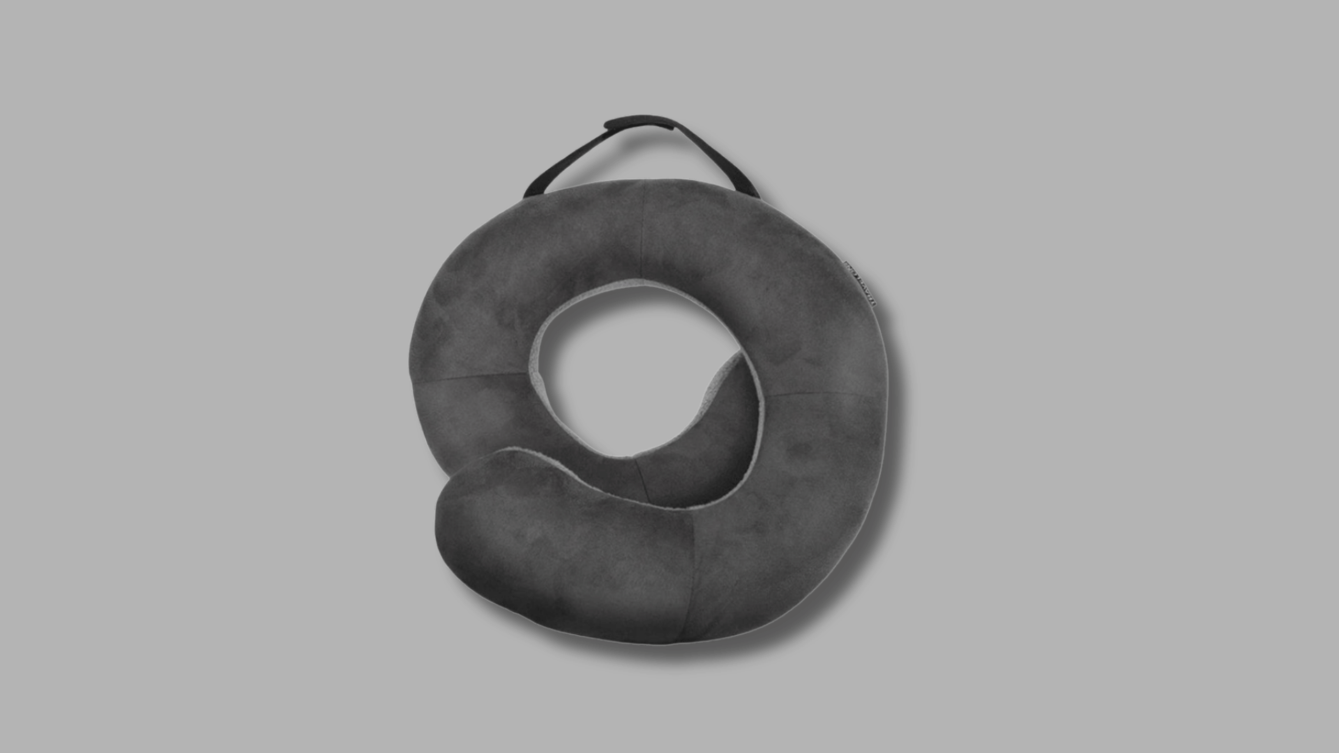 travelon wraparound neck pillow with soft cushioning and integrated carrying handle