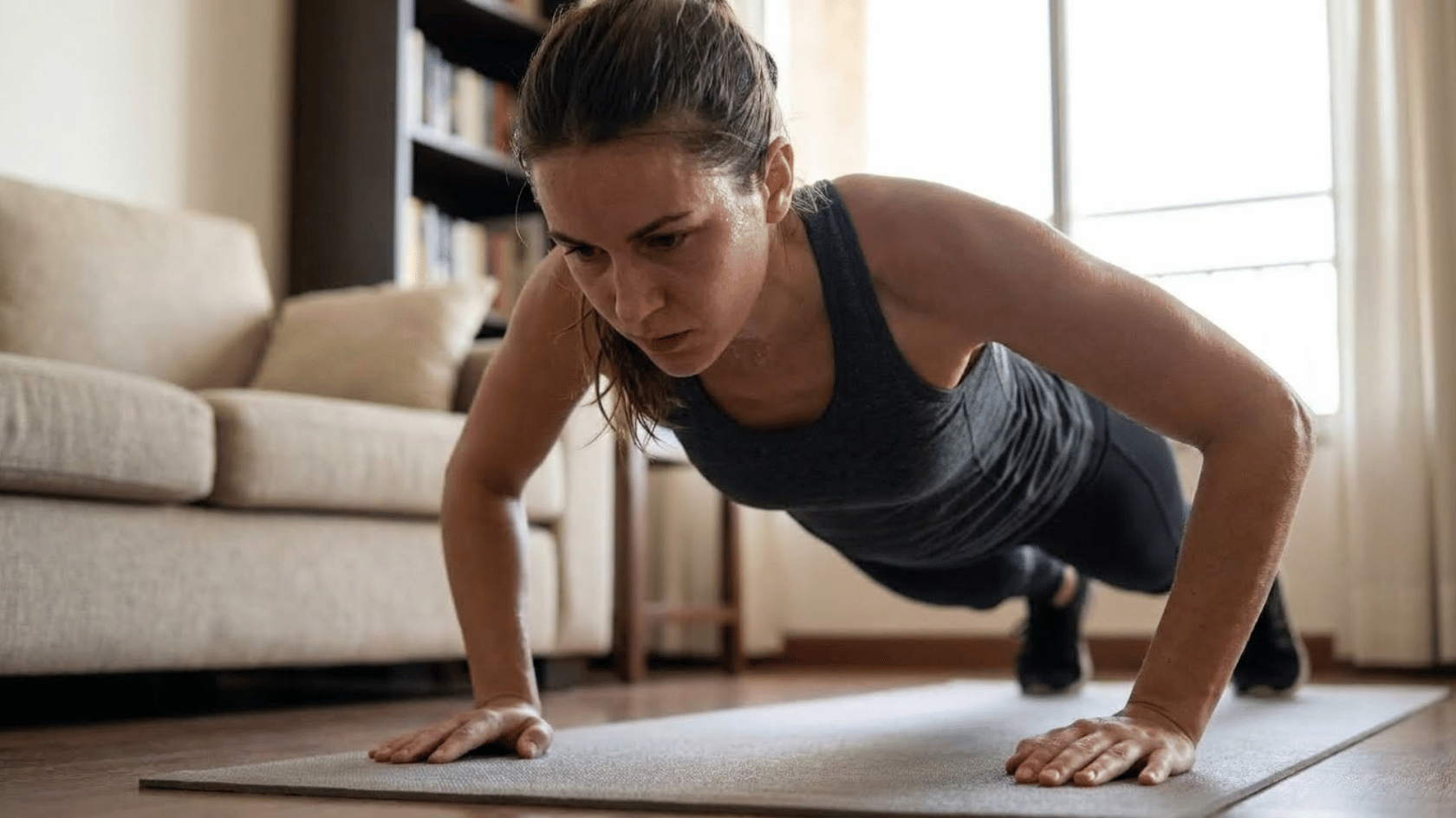 woman doing push ups on an open terrace during a morning workout